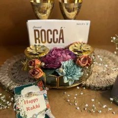 Another view of my royal Rakhi hamper, this time with elegant brass tumblers. It’s a perfect blend of traditional materials and modern luxury, complete with a beautiful rakhi and roli-chawal.