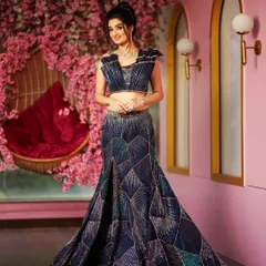 For the modern bride who loves a dramatic silhouette, I designed this sculpted skirt and 3D embroidered blouse. The geometric patterns and corded cut dana work create a stunning, new-age look that is perfect for a reception or cocktail event.