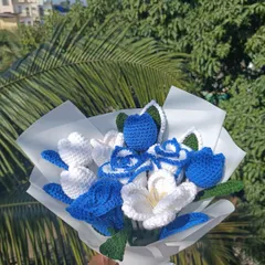 Another view of the custom blue and white bouquet, showing the elegant wrapping.