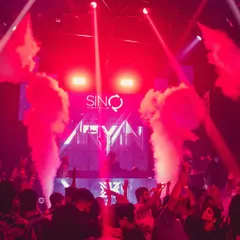 Full production mode at Sinq Nightclub, Goa. Smoke cannons, intense red lighting, and a packed floor. This is the high-octane clubbing experience I deliver.