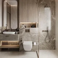 I transform bathrooms into personal spa-like retreats. This design features large-format marble-look tiles, wood-finish cabinetry for warmth, and a glass-partitioned walk-in shower with a rain shower head. The backlit mirror and built-in storage niche add both function and a touch of luxury.