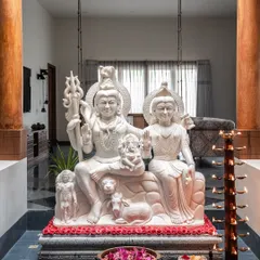The heart of our Prangan project is this courtyard, featuring a magnificent 1500kg marble statue of Lord Shiva and his family, sourced from Varanasi. Flanked by massive teak pillars, this space is the spiritual and aesthetic anchor of the home, embodying serenity and devotion.