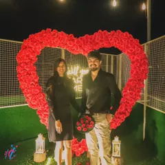 A picture perfect moment. This couple is framed by our signature rose heart and "Will you MARRY ME?" sign, creating a beautiful memory and an amazing photo opportunity.