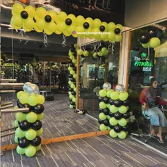This image shows the interior view of the gym decoration. I placed balloon pillars and simple garlands inside to carry the theme throughout the space, ensuring the festive look is visible from all angles.