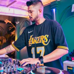 A stylish shot of me mixing at Skyhouse Indore, a rooftop club. I adapt my style and energy to fit every unique venue.