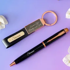 This is my premium pen and keychain set, a perfect mini-combo gift. The set includes a black and rose-gold metal pen and a matching leather strap keychain, both of which can be engraved with a name or a short message.