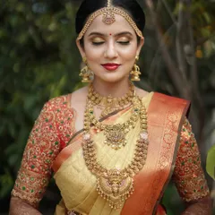 Another beautiful portrait of Taanya, showcasing the intricate temple jewelry that completes her bridal look.