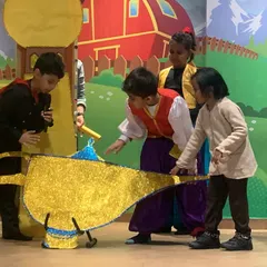 The magical moment of discovering the lamp. Our workshops bring classic stories to life, allowing kids to act out their favorite scenes with creative props and sets.