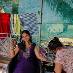 A shot of me teaching a student, guiding her hand as she applies the mehendi. My classes are hands-on and supportive.