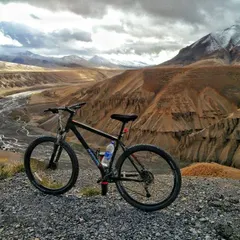 A moment of peace in the rugged Spiti Valley. A bike, a trail, and a view that goes on forever. These are the moments we chase on our high-altitude expeditions.