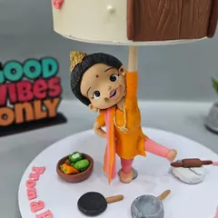 A close-up of the incredible fondant nani figurine, holding up the cake with a single hand. This is where art meets emotion, creating a story that is personal and powerful.