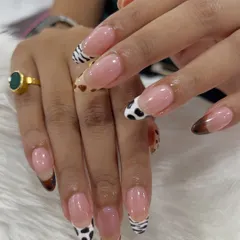 For the client who wants something truly unique, I designed these French tip nail extensions with a wild twist. Each tip features a different hand-painted animal print, including zebra, cow, and leopard, for a playful yet chic look.
