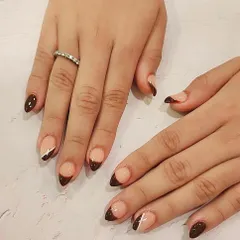 Here’s a chic, modern twist on the classic French tip. I used a rich chocolate brown polish for the tips on these almond-shaped nails and added a single, fine white line as a minimalist accent.