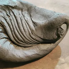 Another view of the spiral pattern created during the kneading process. The lines show how the clay has been folded and pressed to align the clay particles, which is a vital step for successful throwing.