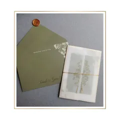 The vellum wrap, tied with simple twine and sealed with a custom wax stamp, adds a layer of softness and anticipation. It’s a perfect example of how simple materials can create a high-end feel.