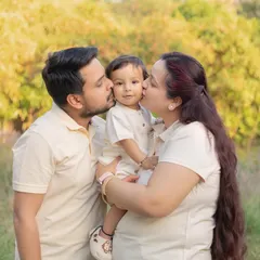 Kisses from mom and dad! My outdoor sessions are all about capturing those sweet, unposed moments of love. The beautiful natural light and relaxed setting let your family's true affection come to life.