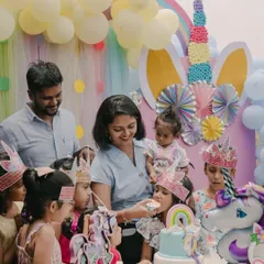 A unicorn-themed birthday party is pure magic! Here, the birthday girl and her friends are celebrating with a beautiful cake, surrounded by whimsical decorations and ready for an afternoon of creative fun.