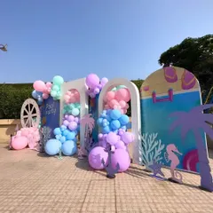 I designed this multi-panel backdrop for a poolside Mehndi party. It combines pastel balloon clusters with nautical and beach-themed cutouts like anchors, seahorses, and coral, creating a unique and stylish photo zone.