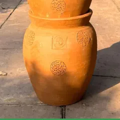 Our terracotta composter is designed to be both beautiful and efficient. The natural clay material helps regulate moisture and temperature, ensuring an odor-free process as your kitchen scraps transform into valuable garden compost.