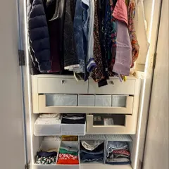 This is a great example of maximizing a smaller closet. We installed multiple drawers and shelf dividers to create designated homes for every category, from jackets on top to folded items and accessories below.