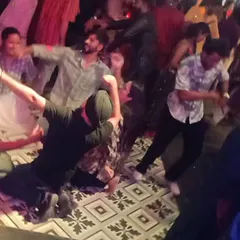 Guests letting loose and enjoying the high-energy Bhangra and Bollywood beats at a private party. This is the kind of wild fun I bring to every celebration.