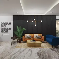 This waiting area for an industrial-style office uses a mix of raw and refined elements. The space features a polished marble floor, an exposed brick wall, and comfortable, colorful furniture to create a professional yet relaxed first impression.