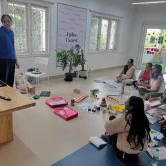 In this training session, I am explaining a concept using a presentation while the educators have the physical learning aids right in front of them. This blend of visual instruction and hands-on practice ensures a deep understanding of early numeracy skills.