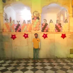 I feel blessed to have decorated the temple for Shyam Baba's birthday. Here I am standing in front of the balloon setup we created. Jai Shree Shyam.