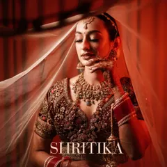 A bridal portrait is more than a photo; it's a piece of art. We use creative lighting and shadows, with the veil as a prop, to create this elegant and soulful portrait of the bride.