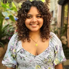 A soft, beautiful curly bob with subtle layers. This cut is perfect for adding volume and shape while keeping a classic, feminine look.