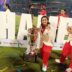 A champion's moment for Tanisha, holding the Delhi Premier League (DPL) trophy. Her success with the South Delhi Superstarz shows the high level our players are competing at and winning.