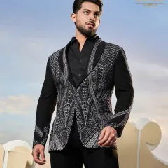 A black tuxedo-style jacket with intricate, geometric silver beadwork. This piece offers a sophisticated way to incorporate Indian craftsmanship into a modern western silhouette.