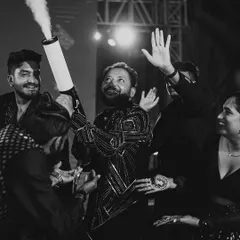 The groom makes a grand entrance at the Sangeet party with a CO2 cannon. It's all about creating high-energy, surprising moments that get the party started.