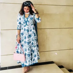 Modern desi style is all about comfort and elegance. This blue and white floral cotton kurta set is perfect for a sunny day out, combining traditional prints with a contemporary silhouette for a look that's effortlessly graceful.