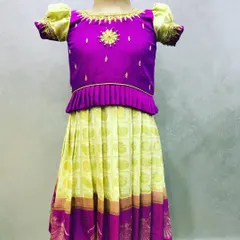 This custom-stitched Paavada set combines a bright purple top with a lime green skirt. I added simple embroidery on the bodice and puff sleeves for a special touch.