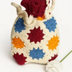 This vibrant crochet potli bag is a burst of color. It's crafted from soft, fine cotton yarn and is fully lined with cotton fabric, making it both beautiful and practical.