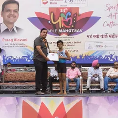 Veer Ugle, our gold medalist in the 7 to 9 boys' category, proudly accepts his certificate and medal. It is inspiring to see such dedication and skill at a young age.