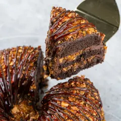 This is our Chocolate Praline Cake, a favourite for those who love a bit of crunch. The cake is covered in a delicious layer of caramelized nuts.