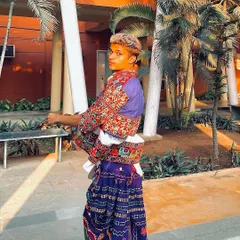 A stylish pose in a purple dhoti and embroidered Kedia. This outfit is a perfect blend of traditional craftsmanship and modern style.