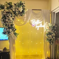The same 'Better Together' setup shown with warm yellow lighting, demonstrating how the ambiance can be changed. We can adjust the lighting to match the mood of your event.