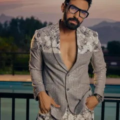 This is where modern style meets fearless design. We crafted this sequined and floral-printed co-ord set for the man who isn't afraid to be the center of attention. It's a perfect example of our fusion wear, blending contemporary silhouettes with dramatic textures for parties and cocktail events.