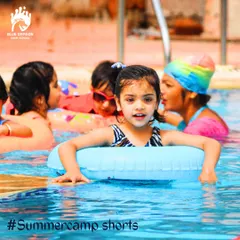 This young swimmer is enjoying her time in the pool during our summer camp. We create a supportive atmosphere where kids can learn at their own pace and build confidence in the water.