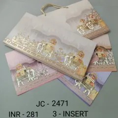 A detailed illustration of a royal elephant procession adorns this wedding invitation set. The design comes in several pastel color options for the inserts, all packaged in a convenient carry bag.