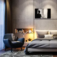 A cozy bedroom corner with a quilted armchair, a zebra-print rug, and a built-in niche for books. The dark, textured walls and soft lighting create an intimate and moody atmosphere.