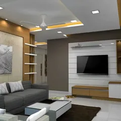 This image shows a complete living room layout centered around a clean and functional TV wall. The simple wood and white console keeps the focus on the overall space, which includes a false ceiling with cove lighting.