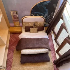 Before a single piece of full-size furniture is built, a detailed scale model can bring an interior design concept to life. This miniature bedroom prototype helps visualize space, texture, and layout in a tangible way.