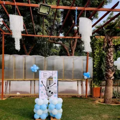 A fun "Pin the Nose on Olaf" game station set up in the party area. I love incorporating themed activities to keep the little guests entertained throughout the event.