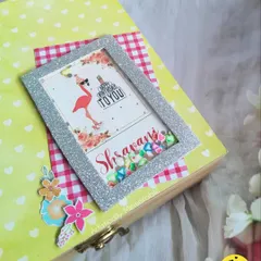 A closer look at the custom shaker frame on this yellow hamper box. The little details and floral accents make it pop.