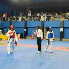 Officiating a match. My experience as a competitor and coach helps me be a fair and effective referee.