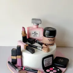 For the ultimate makeup and shopping lover! This cake is a tribute to all things glam, featuring an array of handcrafted, edible Chanel makeup products. From the lipstick and perfume bottle to the eyeshadow palette and brushes, every detail is sculpted from sugar.